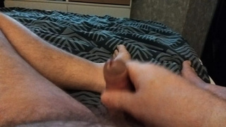 My friend's BF is lying in bed jerking off and playing with his little prick